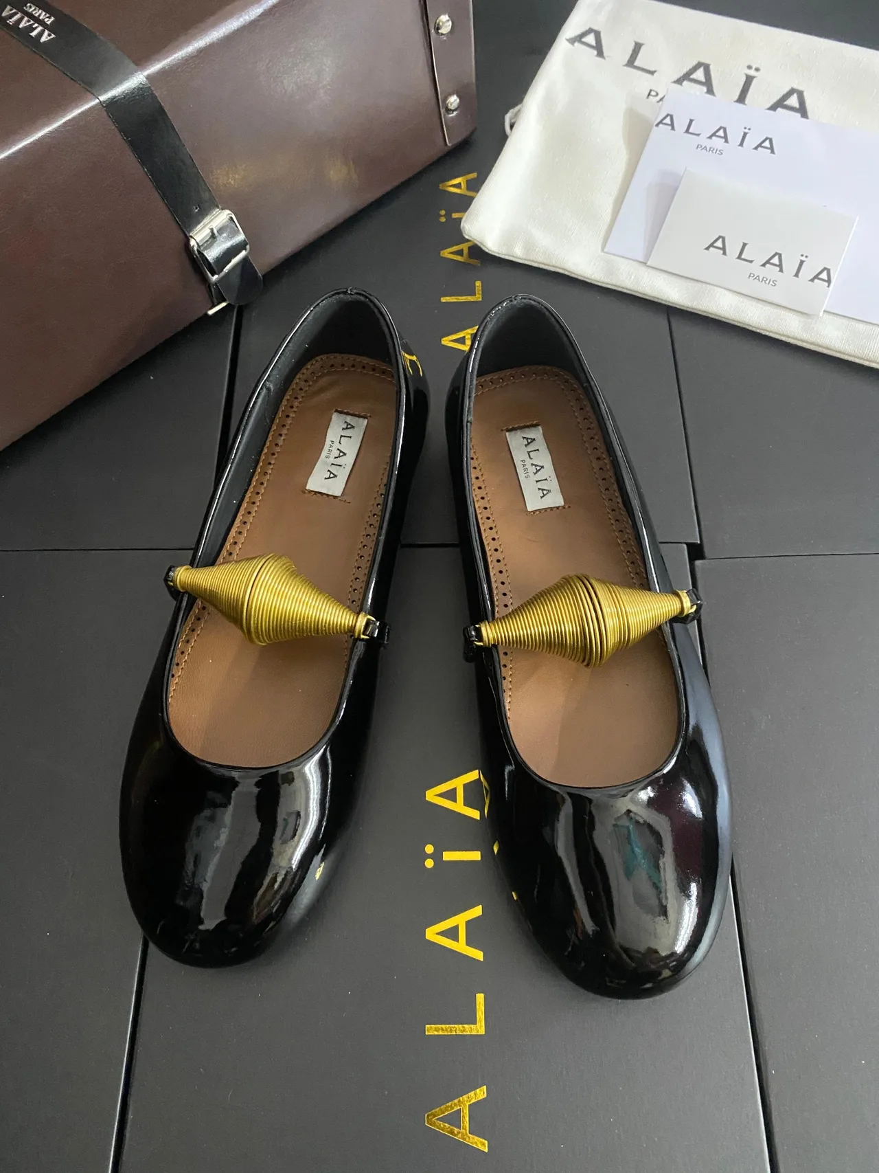 Alaia Cowhide Sheepskin Glossy Square-Toe Mary Jane Flats in Black · view 1