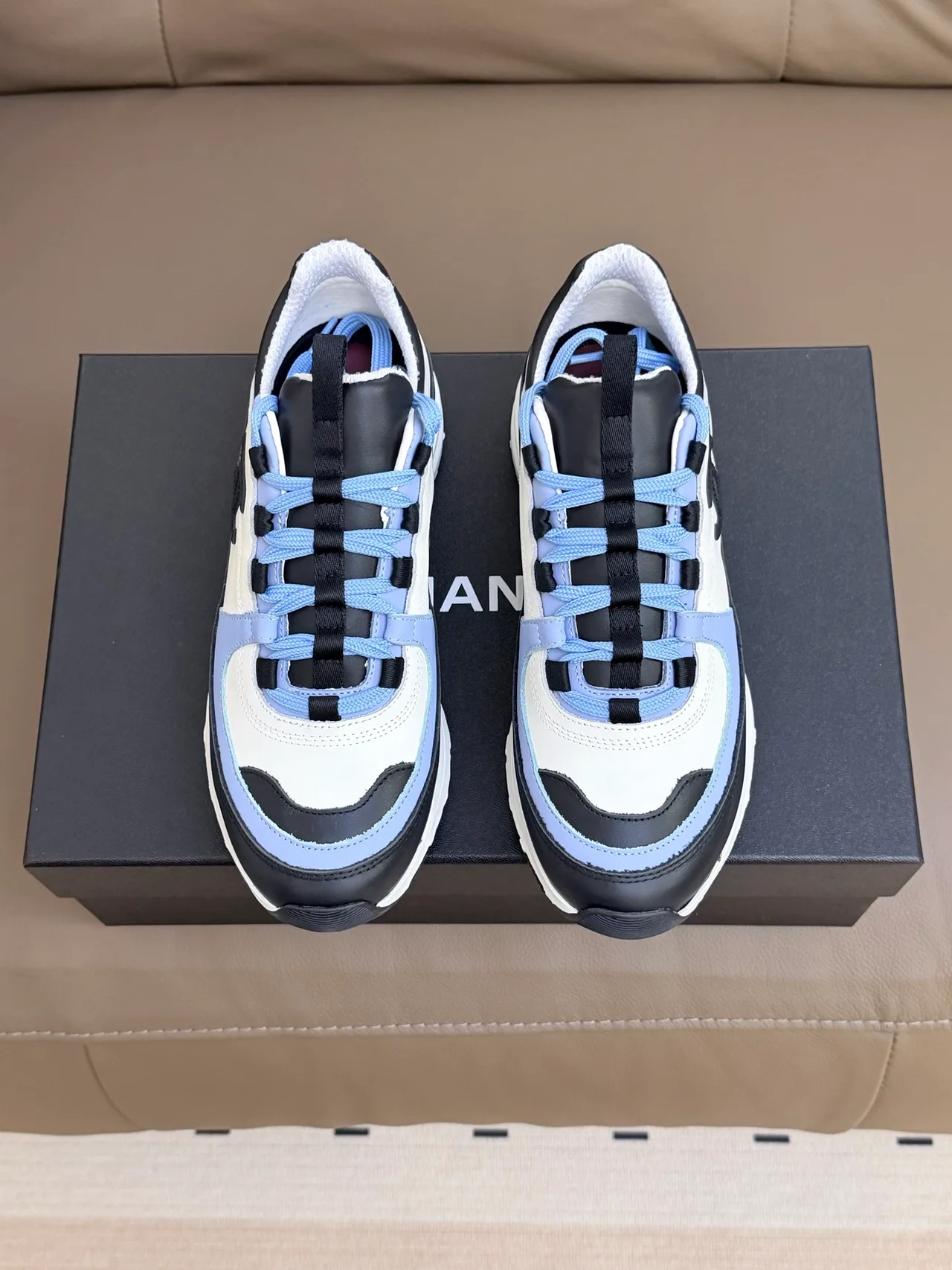 Chanel Cowhide Sheepskin Sneakers in White · view 1