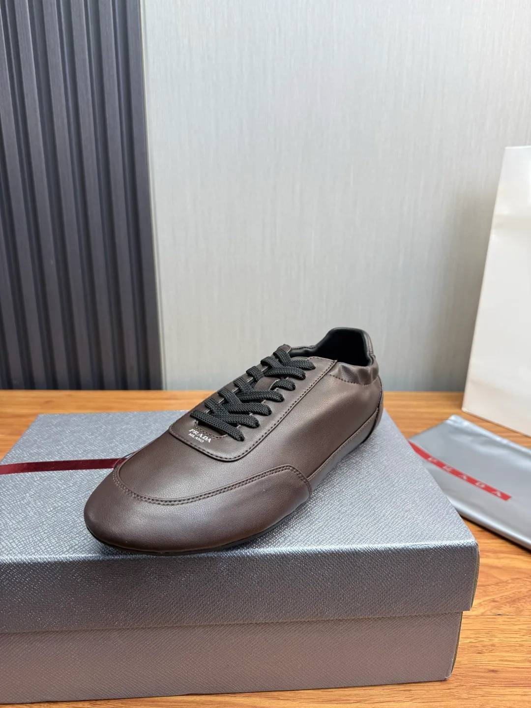 Prada Cowhide Quilted Round-Toe Sneakers in Brown · view 1