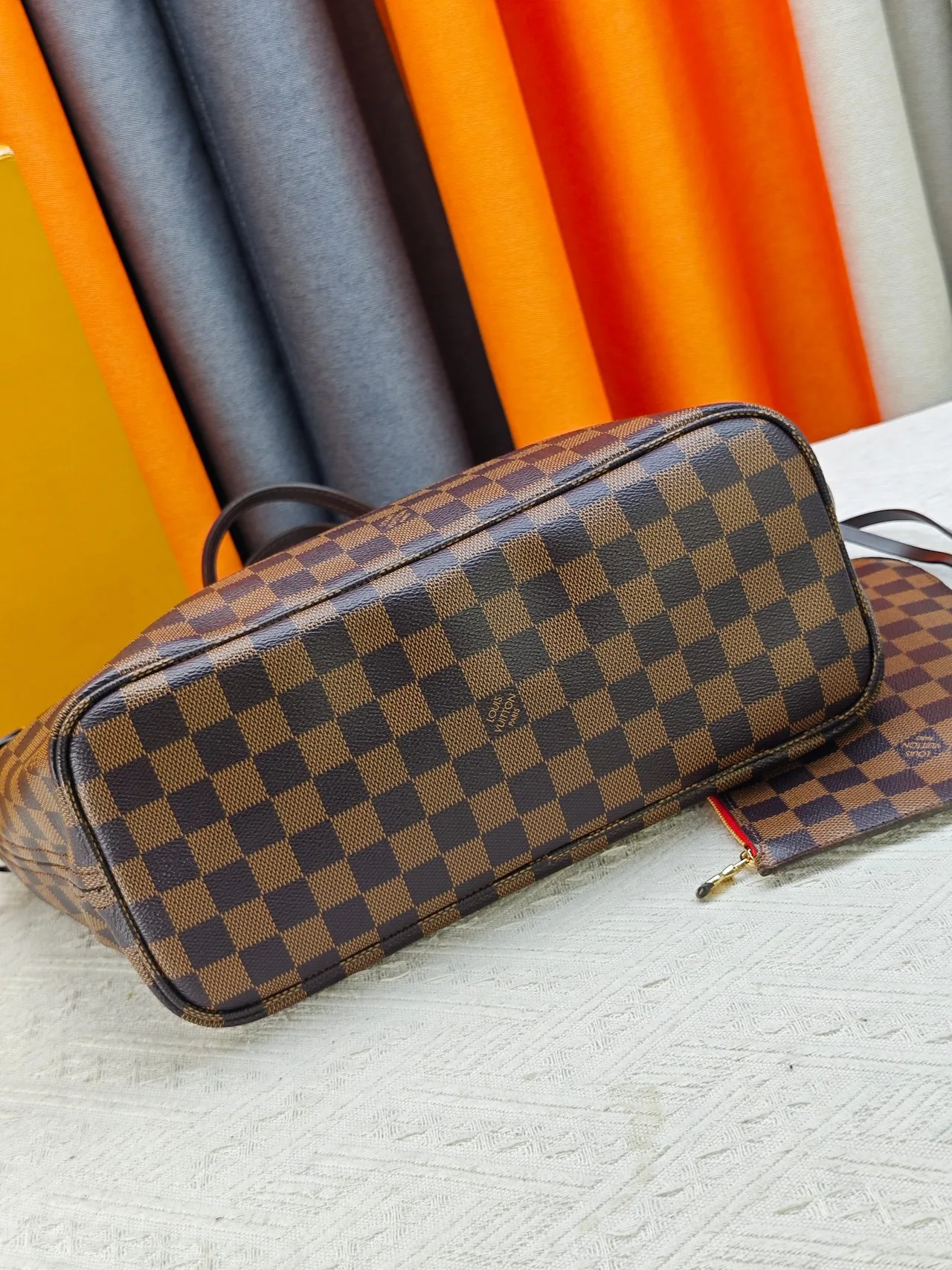 Louis Vuitton Neverfull Clutch in Brown · view 5