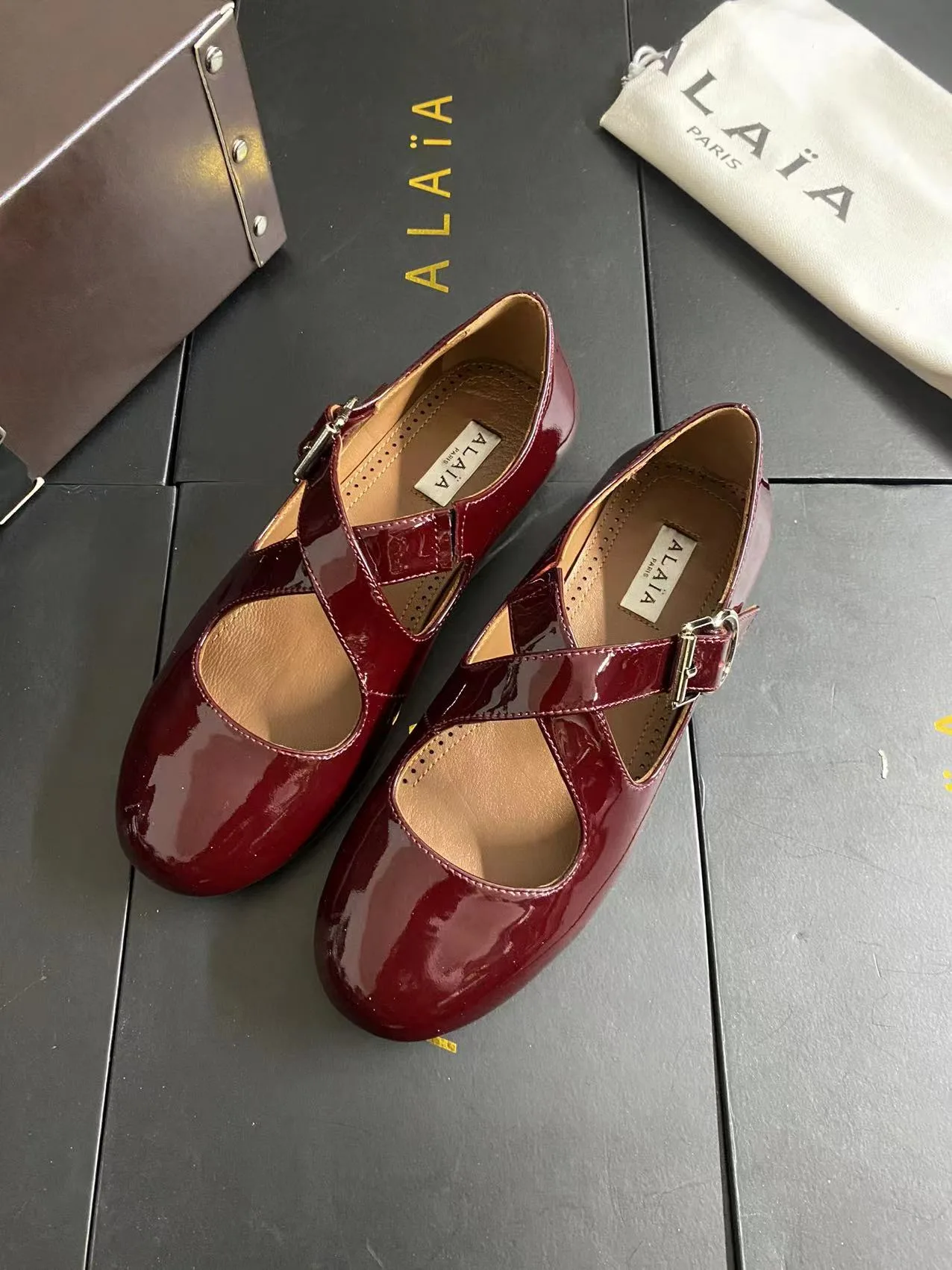 Alaia Cowhide Sheepskin Glossy Square-Toe Buckle Cross-Strap Mary Jane Flats in Burgundy · view 6