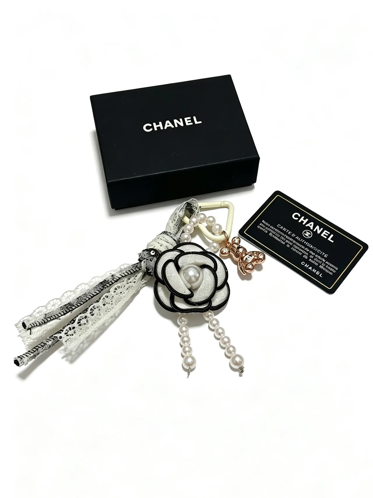 Chanel Glossy Camellia Key Charm in White · view 3