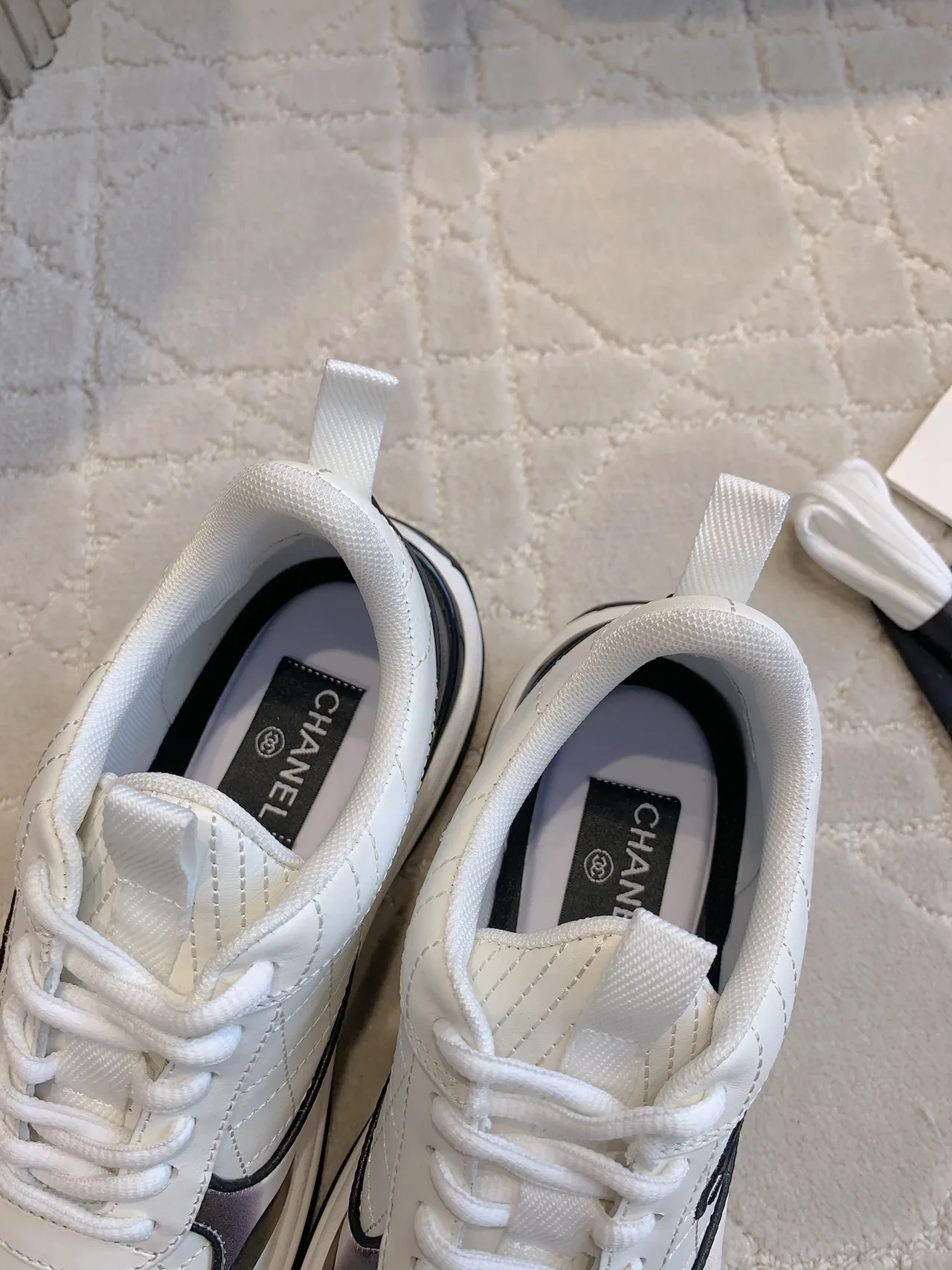 Chanel Quilted Sneakers in White · view 5