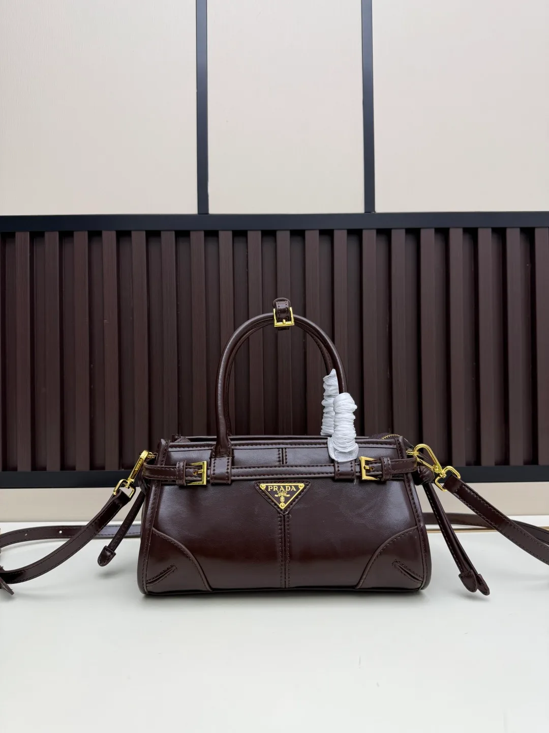 Prada Calfskin Buckle-Detail Structured Top-Handle Bag in Brown · view 1