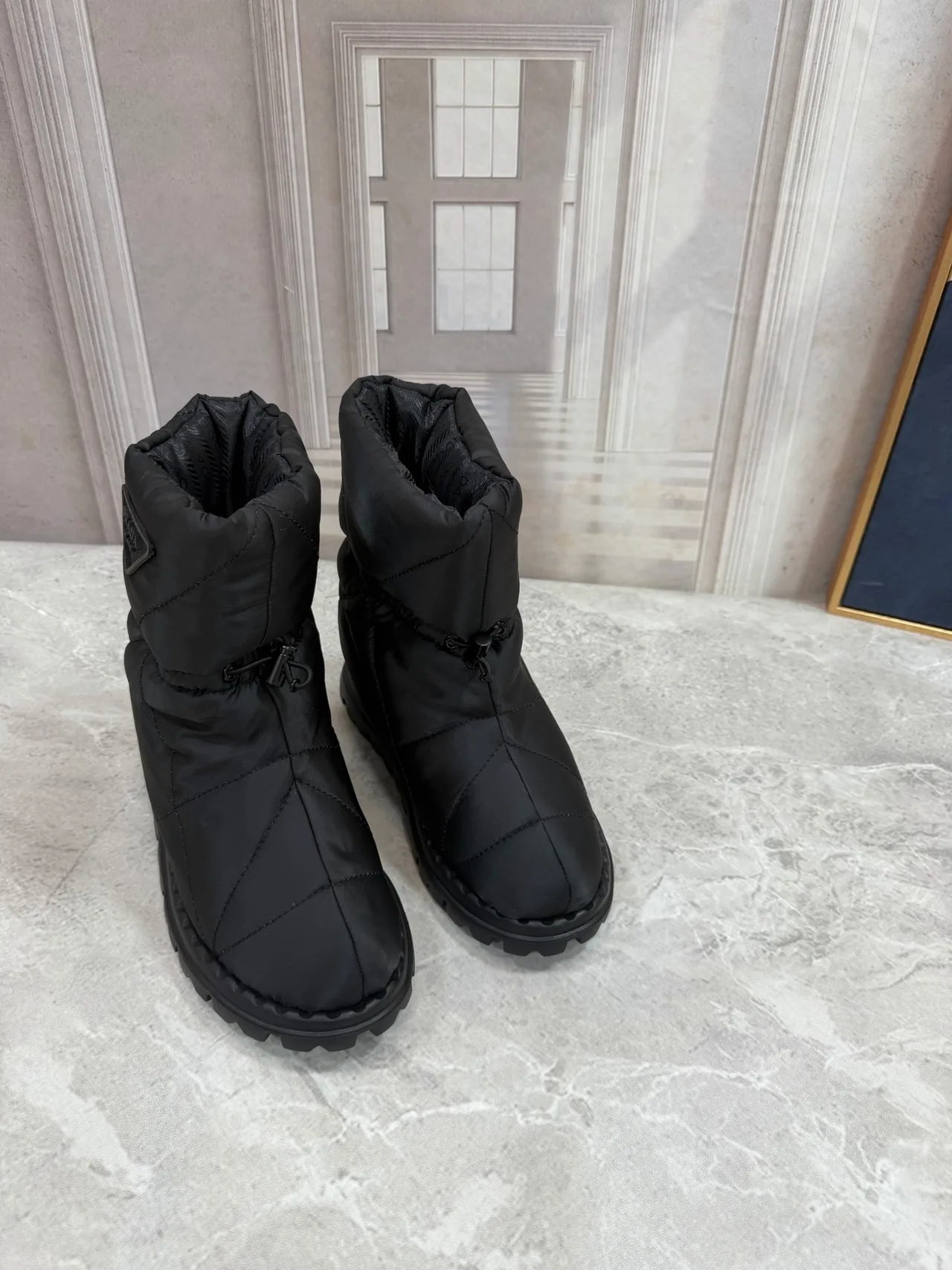 Prada Puffer Boots in Black · view 8