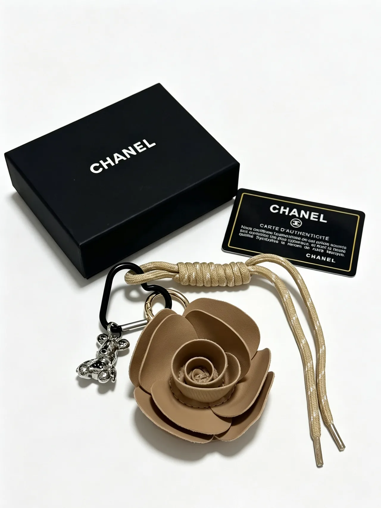 Chanel Woven Rose Keychain in Brown · view 1