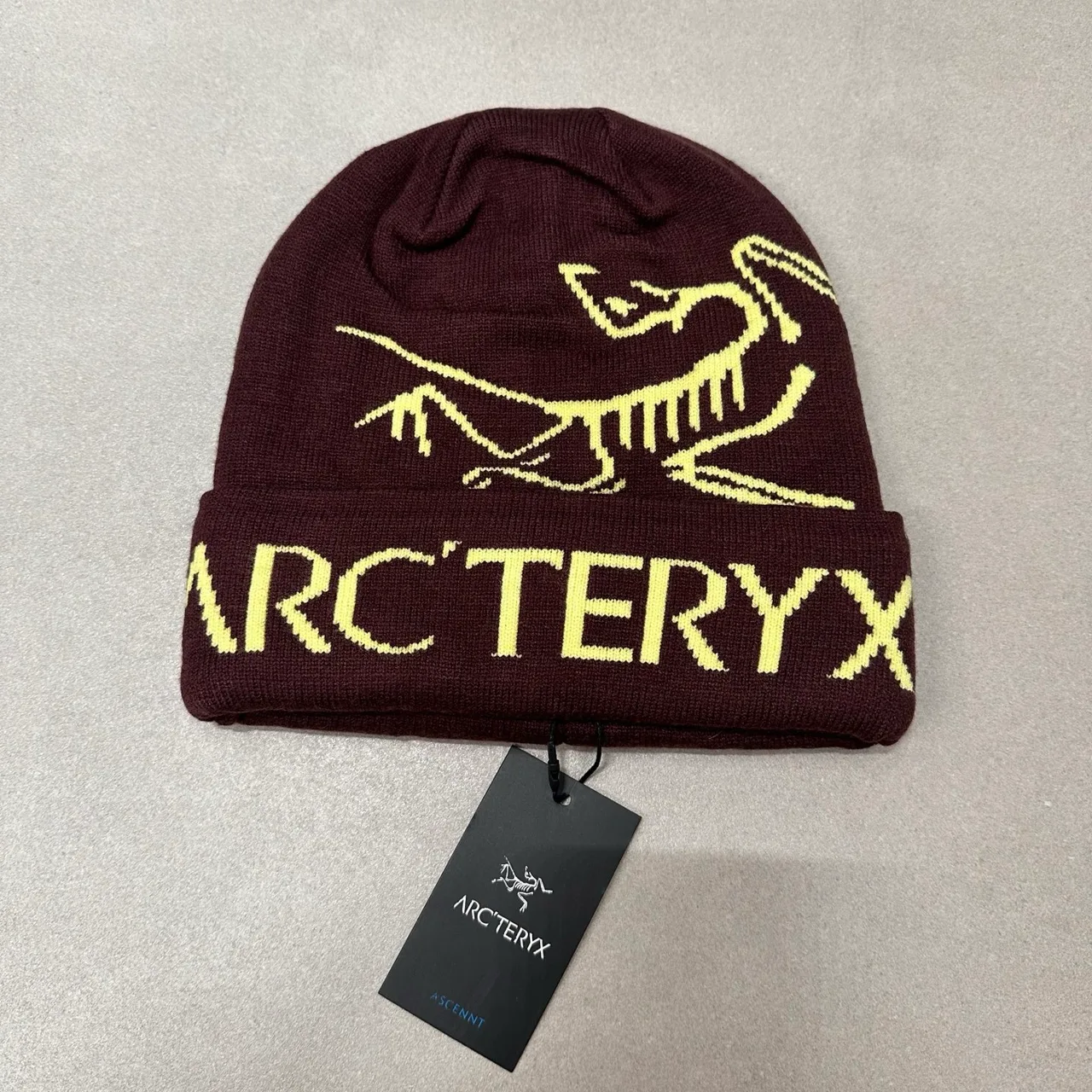 Arc'teryx Graphic knit beanie in Cream & Grey & Burgundy & Orange & Green & Pink & Yellow & Black & Blue & Beige & Tan · view 3