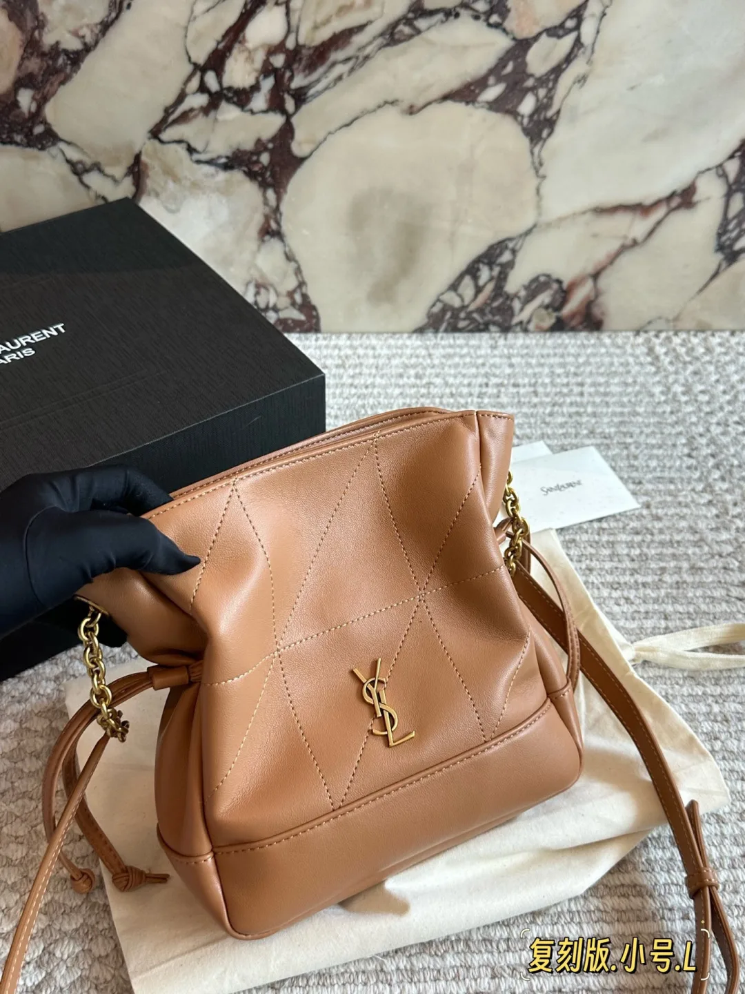 Saint Laurent Quilted Bucket Bag in Tan · view 1