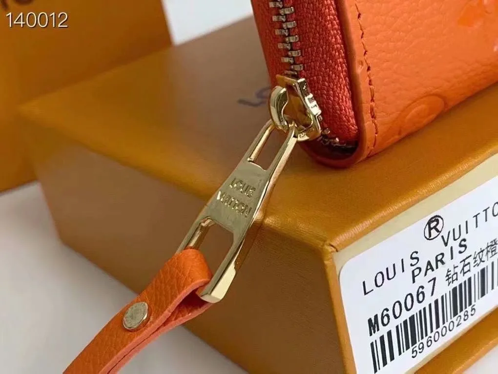 Louis Vuitton Zip Coin Wallet in Orange · view 5