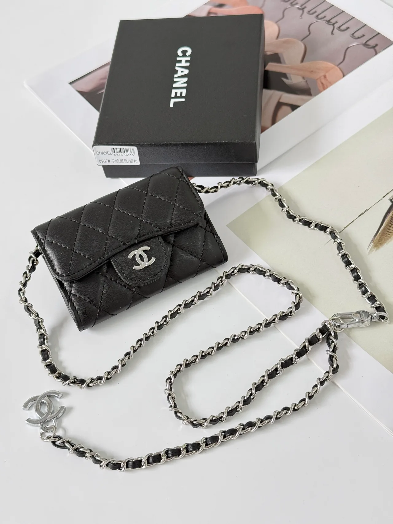 Chanel Quilted Glossy Handbag in Black · view 1