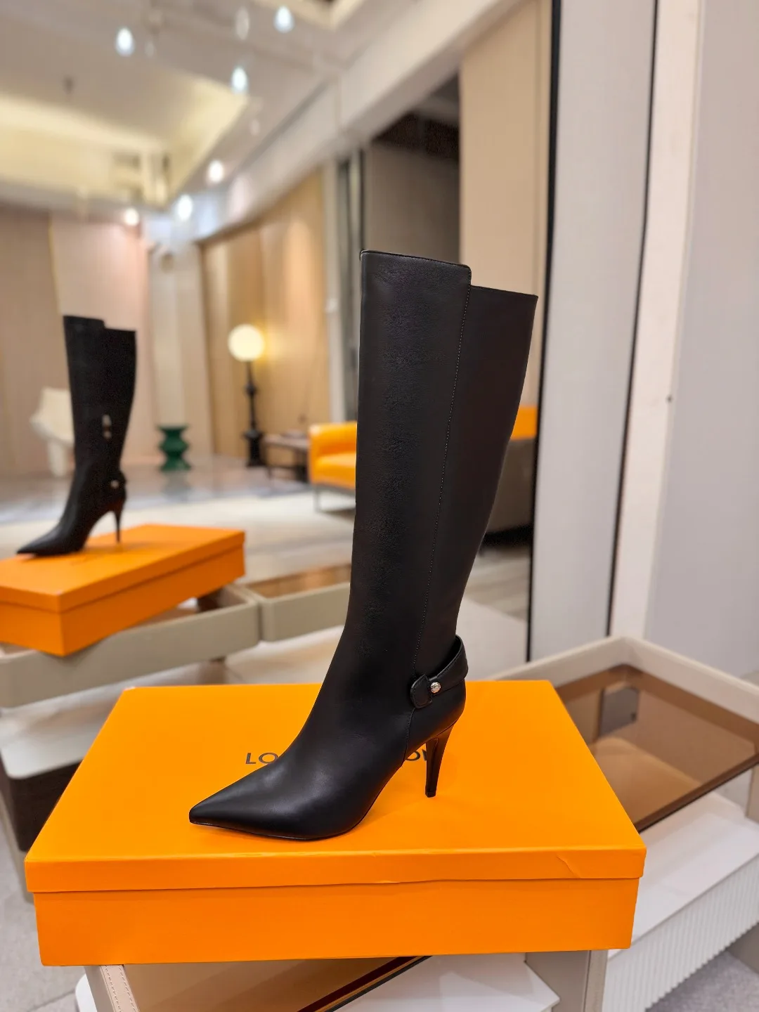 Louis Vuitton Calfskin Glossy Pointed-Toe Buckle Knee-High Stiletto Boots in Black · view 1