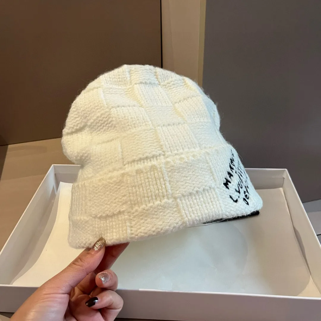 Louis Vuitton Maison Vuitton knit beanie in Cream & Black · view 1