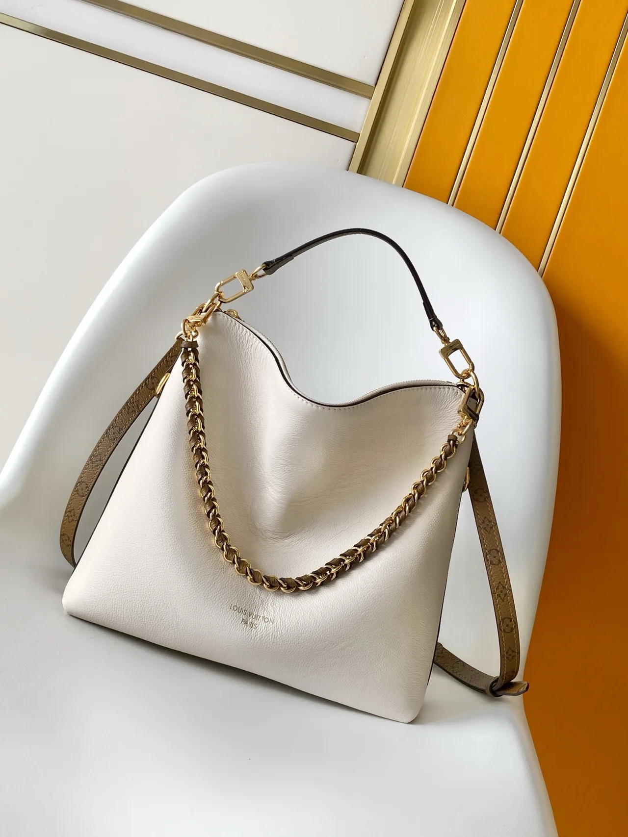 Louis Vuitton Cowhide Canvas Hobo Bag in White · view 1
