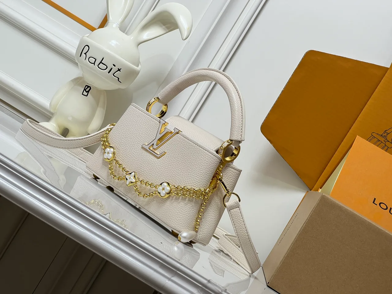 Louis Vuitton Cowhide Smooth Capucines East West Bag in Cream · view 3