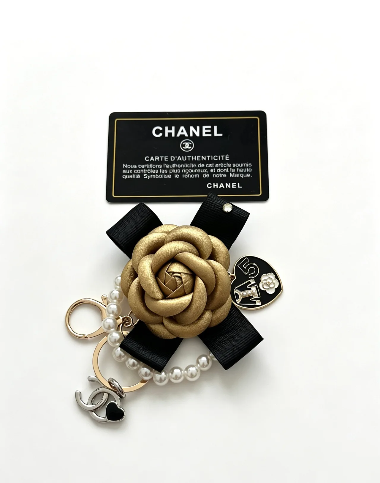 Chanel Glossy Camellia Keychain in Gold · view 3