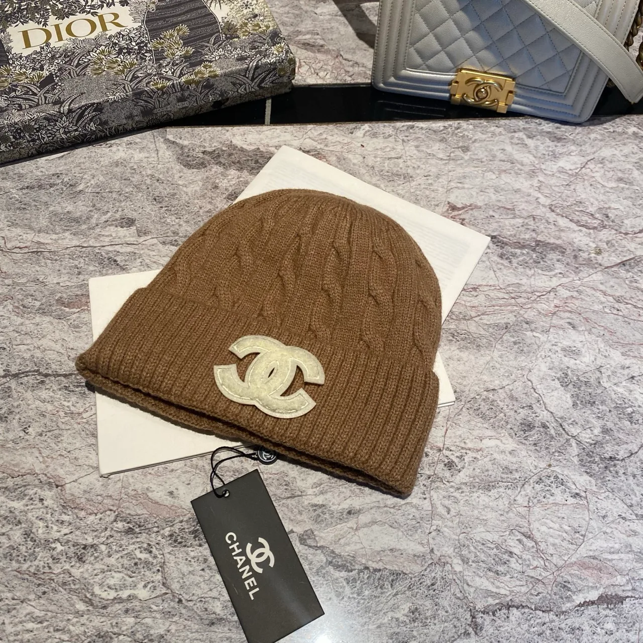 Chanel CC Cable-Knit Beanie in Brown / White / Grey / Pink / Black / Blue / Red · view 1