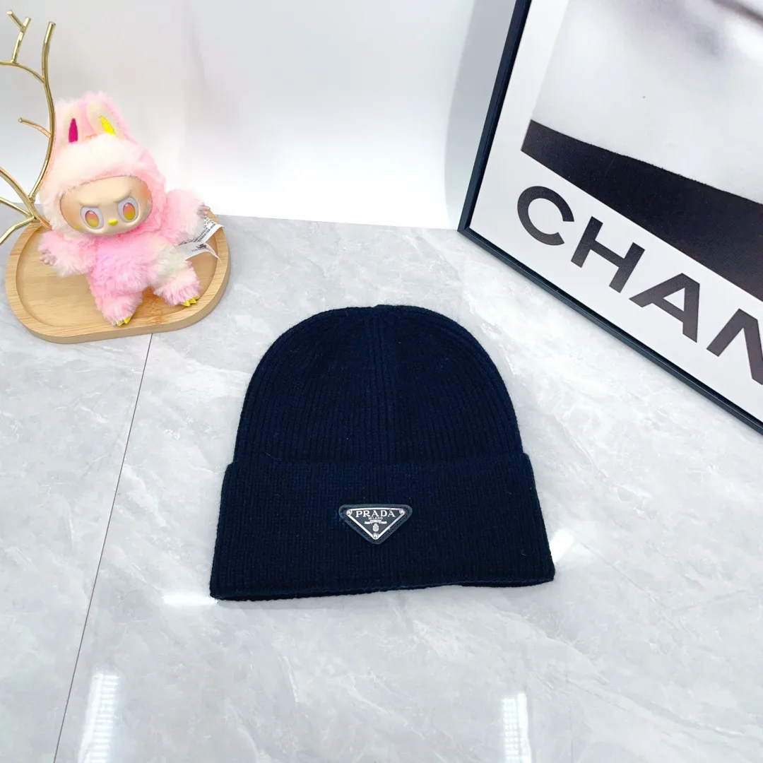 Prada Triangle-Badge Beanie in Black & Grey & White & Beige & Brown & Yellow & Blue & Pink & Red · view 1
