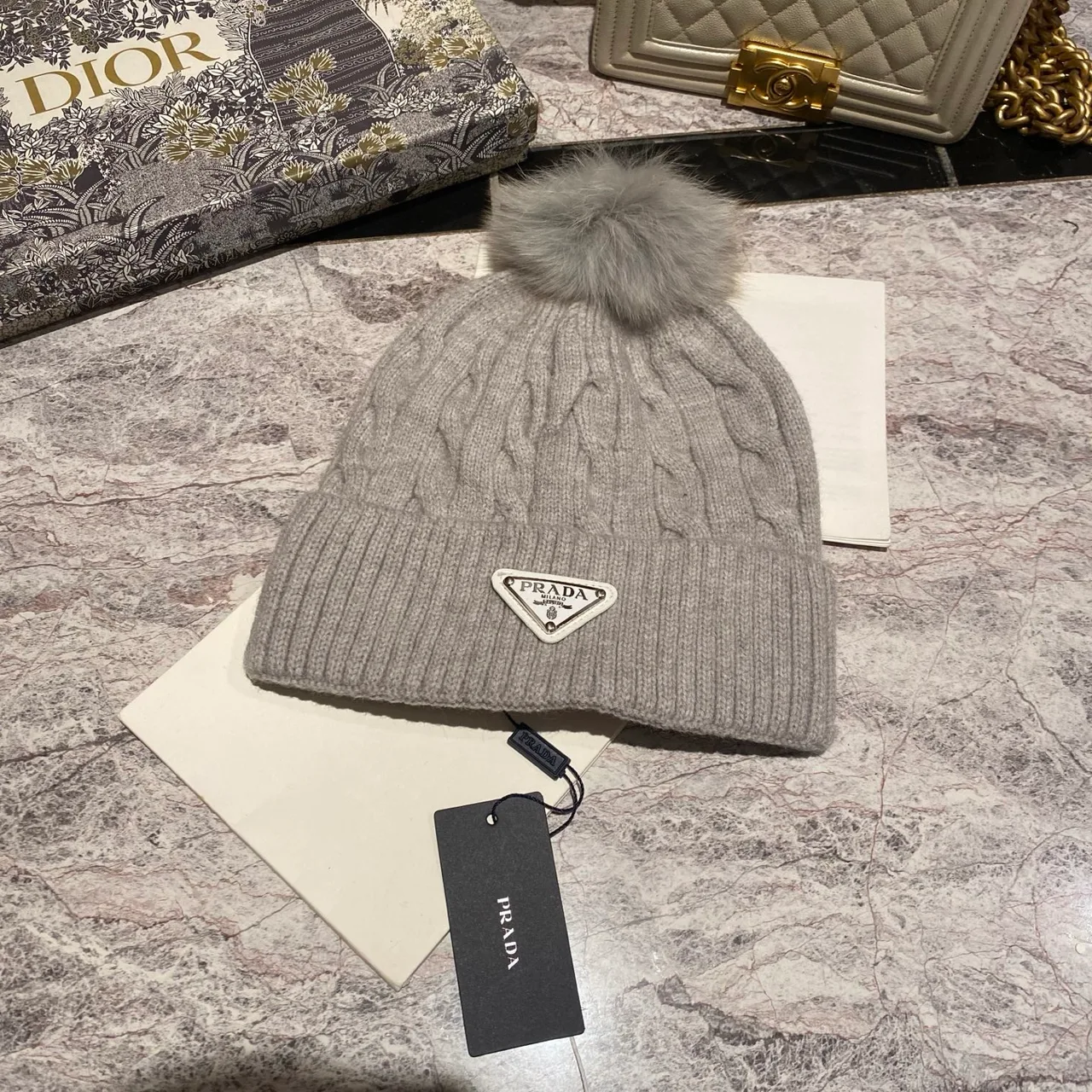 Prada Cable knit pom beanie in Black & White & Grey & Brown & Cream & Blue & Burgundy & Pink · view 7