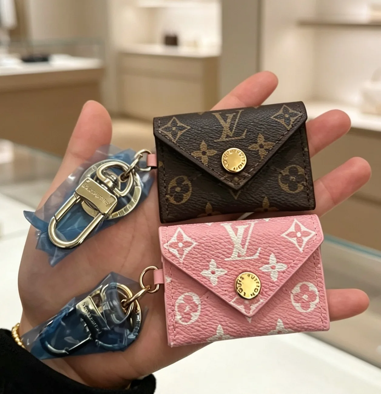Louis Vuitton Monogram Mini Envelope Keychain in Brown & Pink · view 1