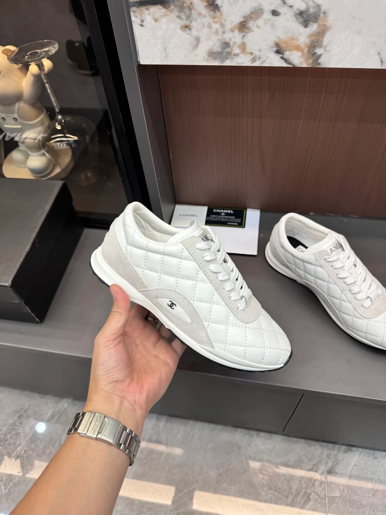 Chanel Quilted Glossy Sneakers in White · view 7