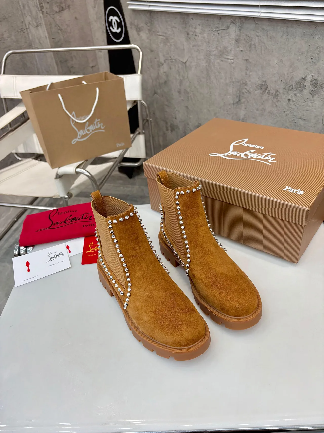 Christian Louboutin Stud-trim ankle boots in Black & Tan · view 3