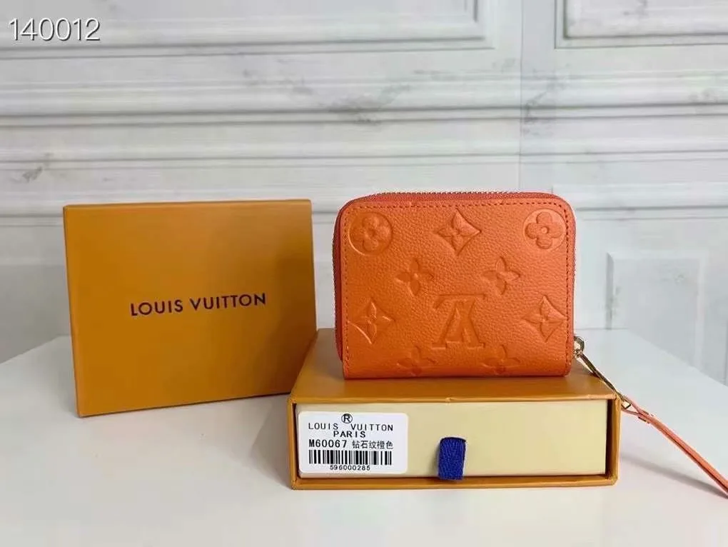 Louis Vuitton Zip Coin Wallet in Orange · view 1