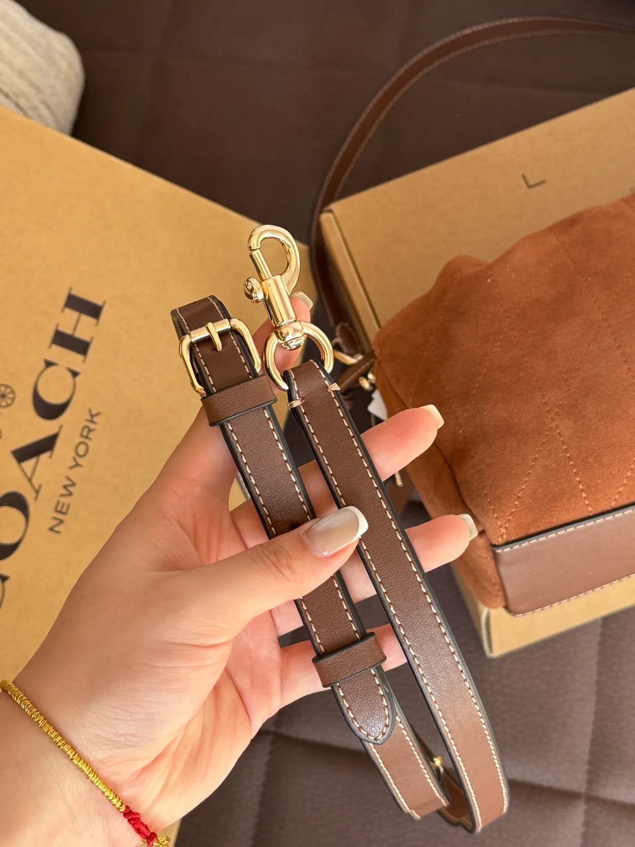 Quilted Suede-Look Drawstring Shoulder Bag in Brown · view 7