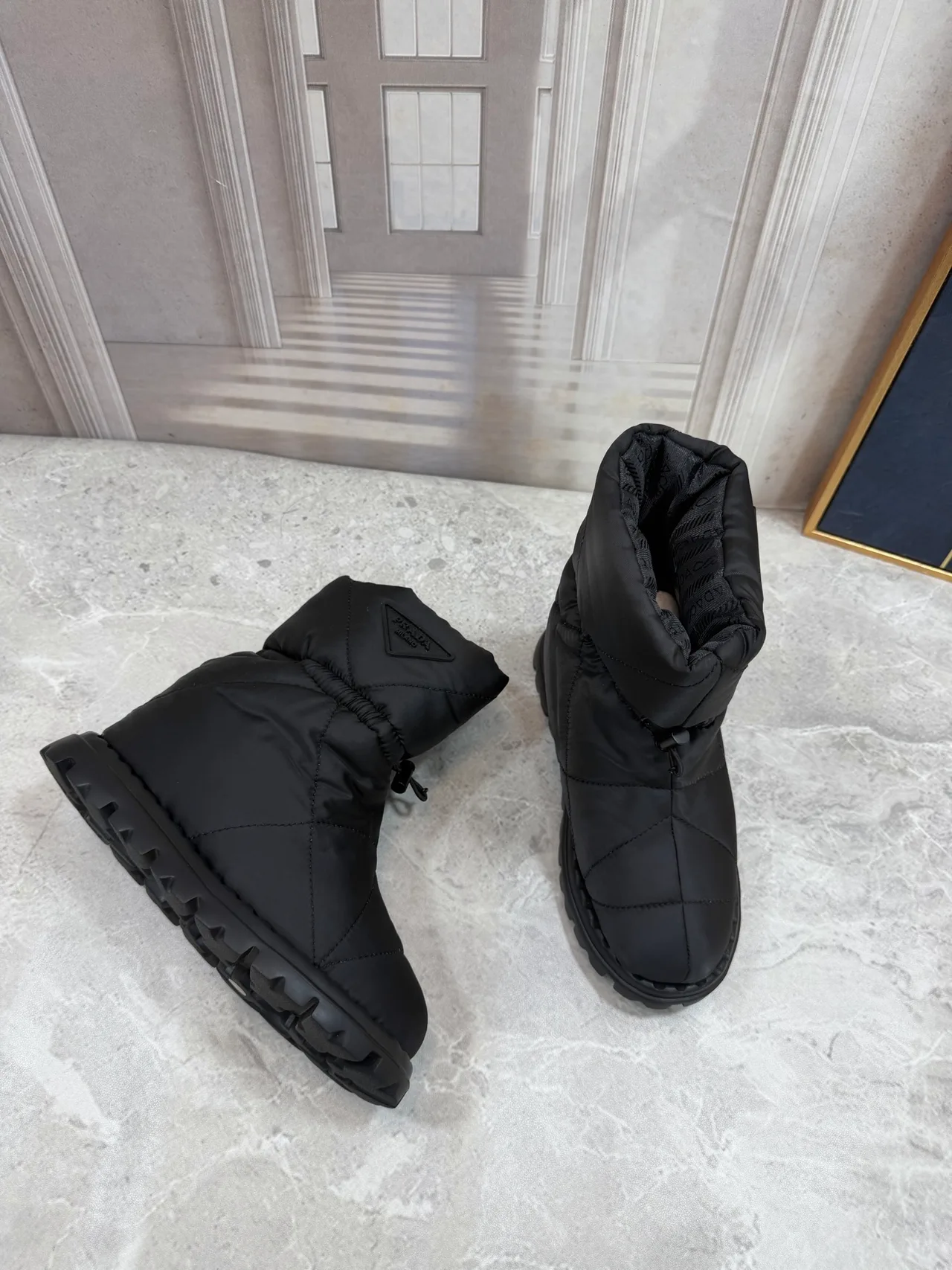 Prada Puffer Boots in Black · view 1
