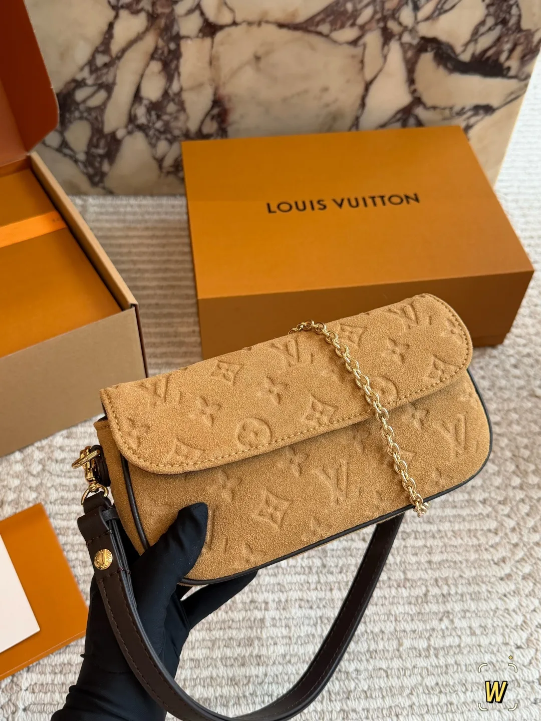 Louis Vuitton Suede Monogram Clutch in Tan · view 1