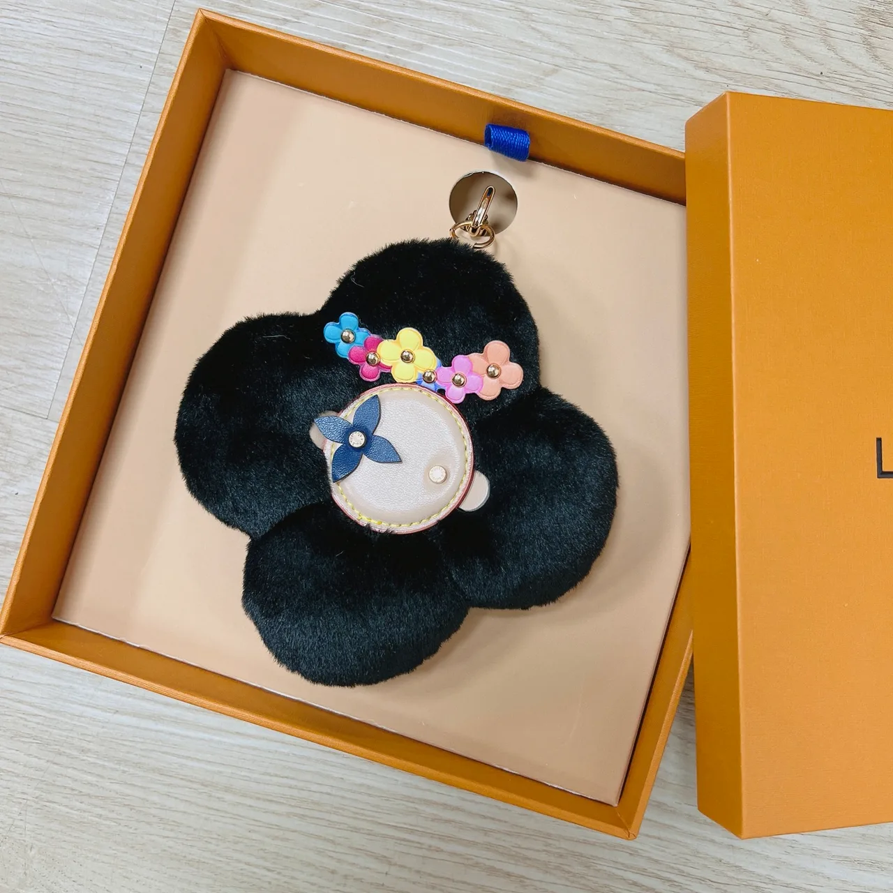 Louis Vuitton Faux-fur flower bag charm in Purple & White & Brown & Yellow & Red & Pink & Black & Blue & Cream · view 7