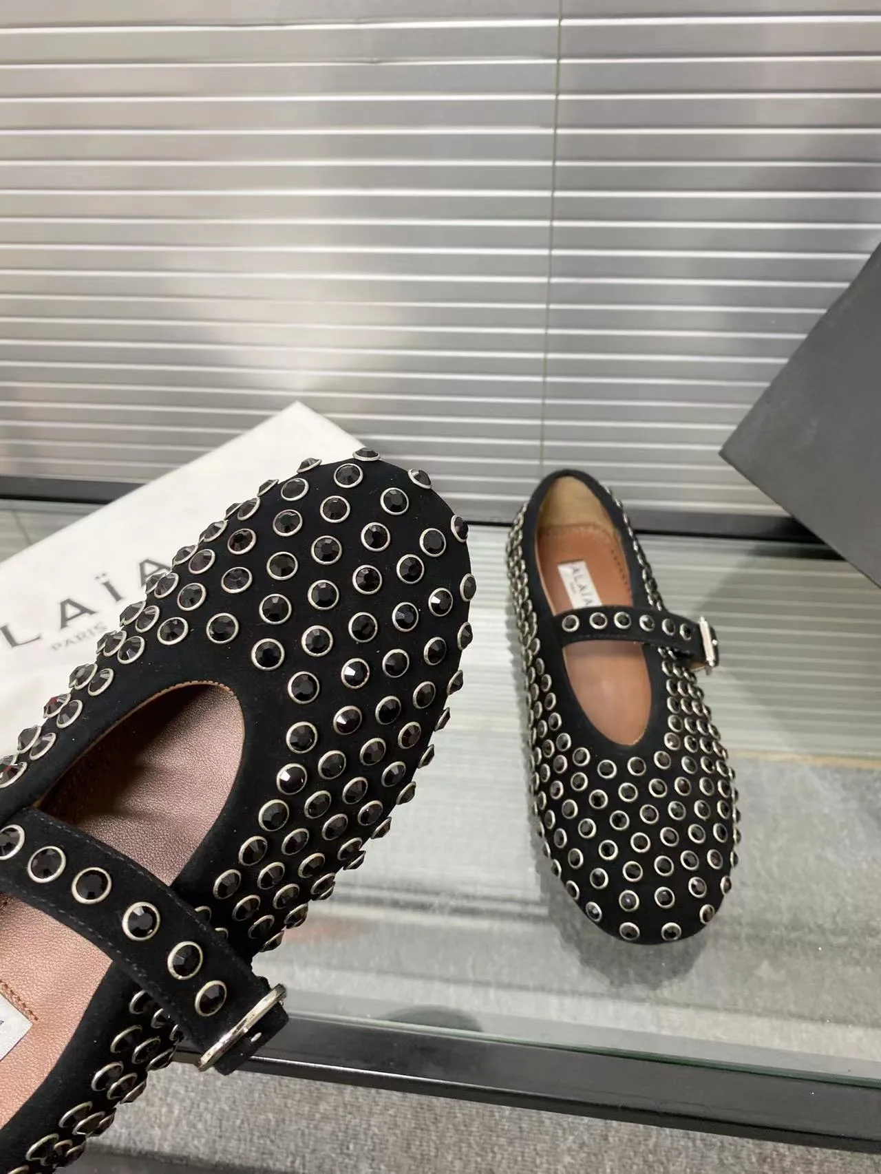 Alaia Cowhide Sheepskin Round-Toe Studded Mary Jane Flats in Black · view 7