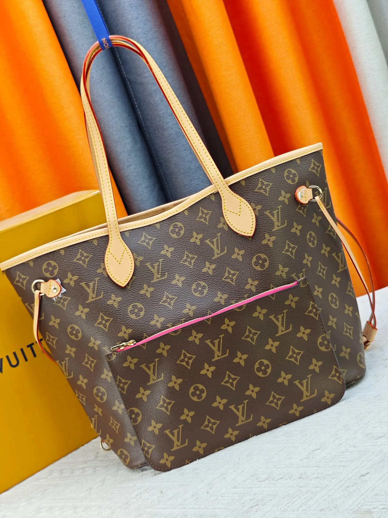 Louis Vuitton Neverfull Clutch in Brown · view 1