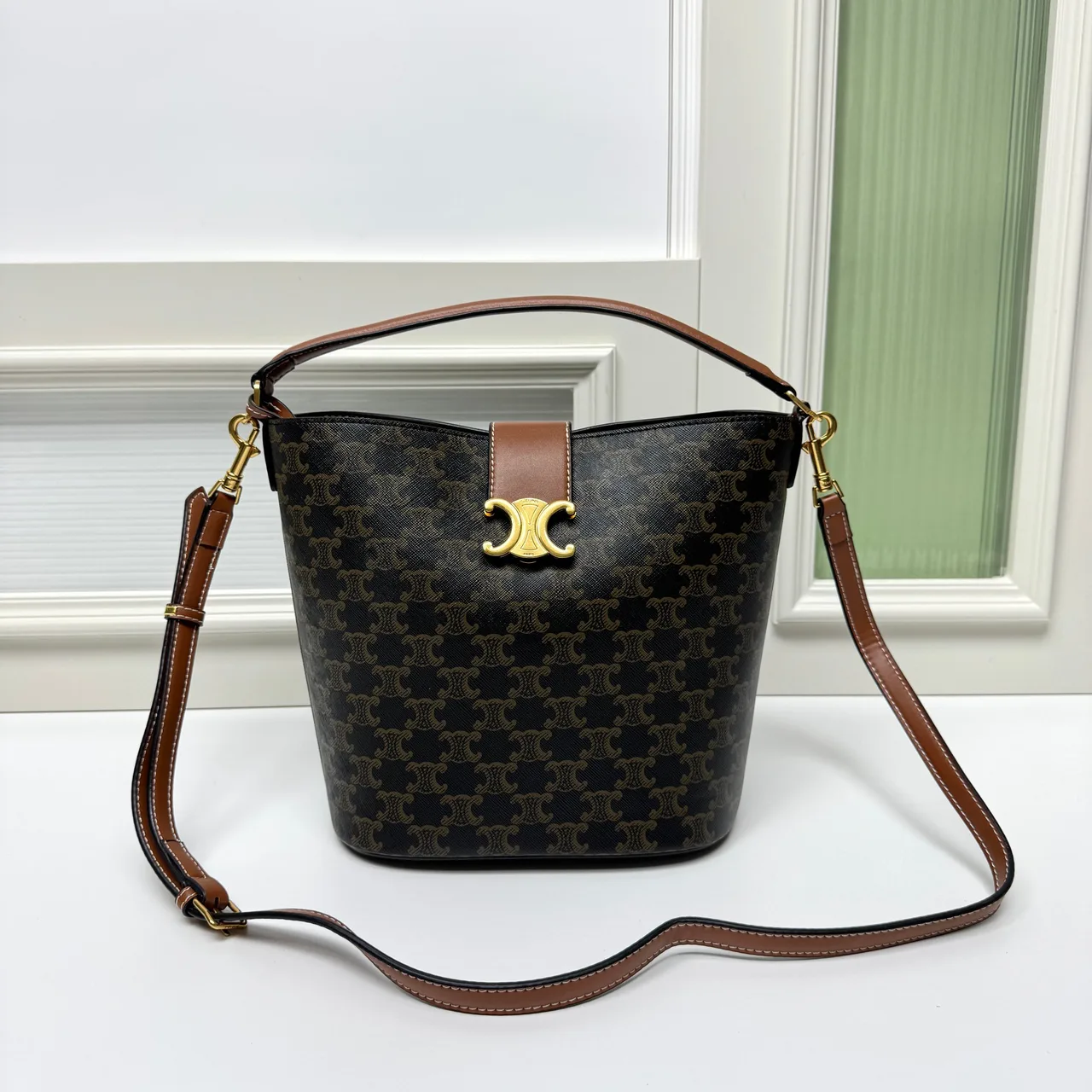 Celine Calfskin Quilted Monogram Bucket Bag in Brown · view 1
