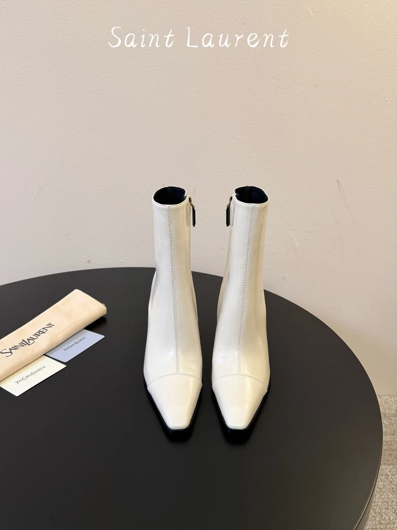 Saint Laurent Glossy Pointed-Toe Ankle Boots in White · view 1