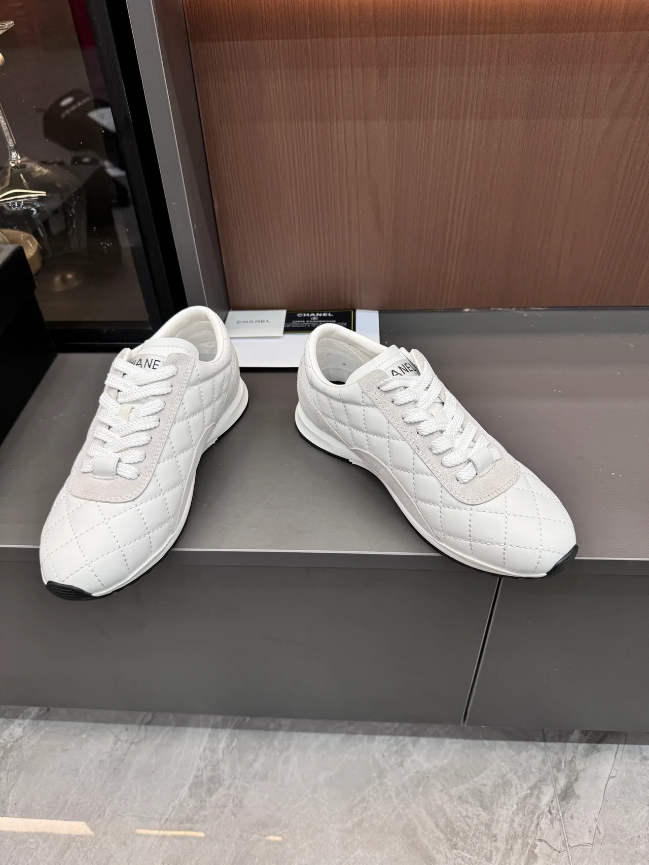 Chanel Quilted Glossy Sneakers in White · view 5