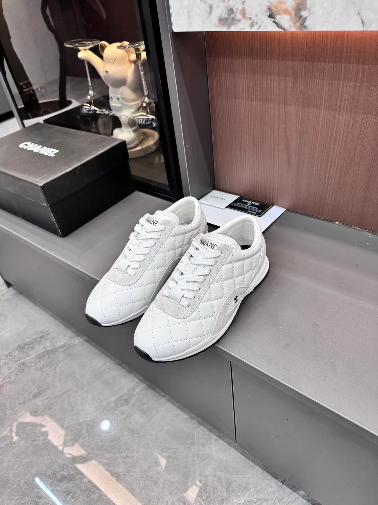 Chanel Quilted Glossy Sneakers in White · view 2