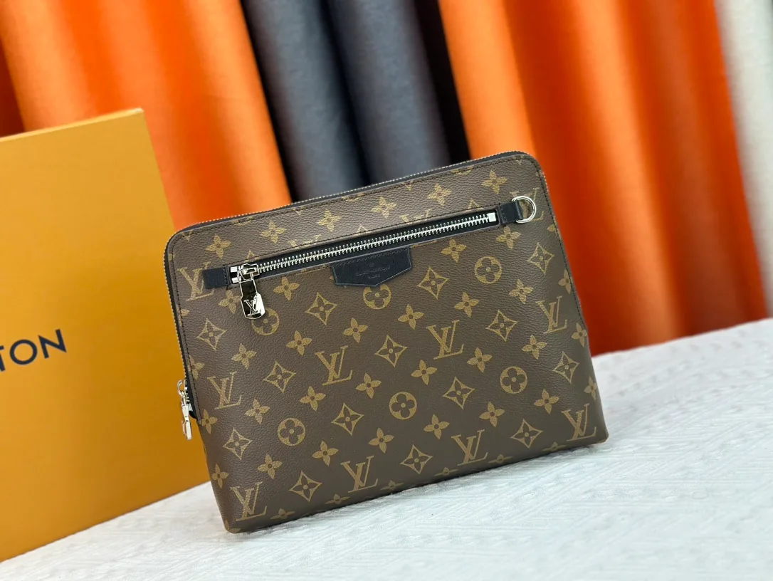 Louis Vuitton Canvas Clutch in Brown · view 1