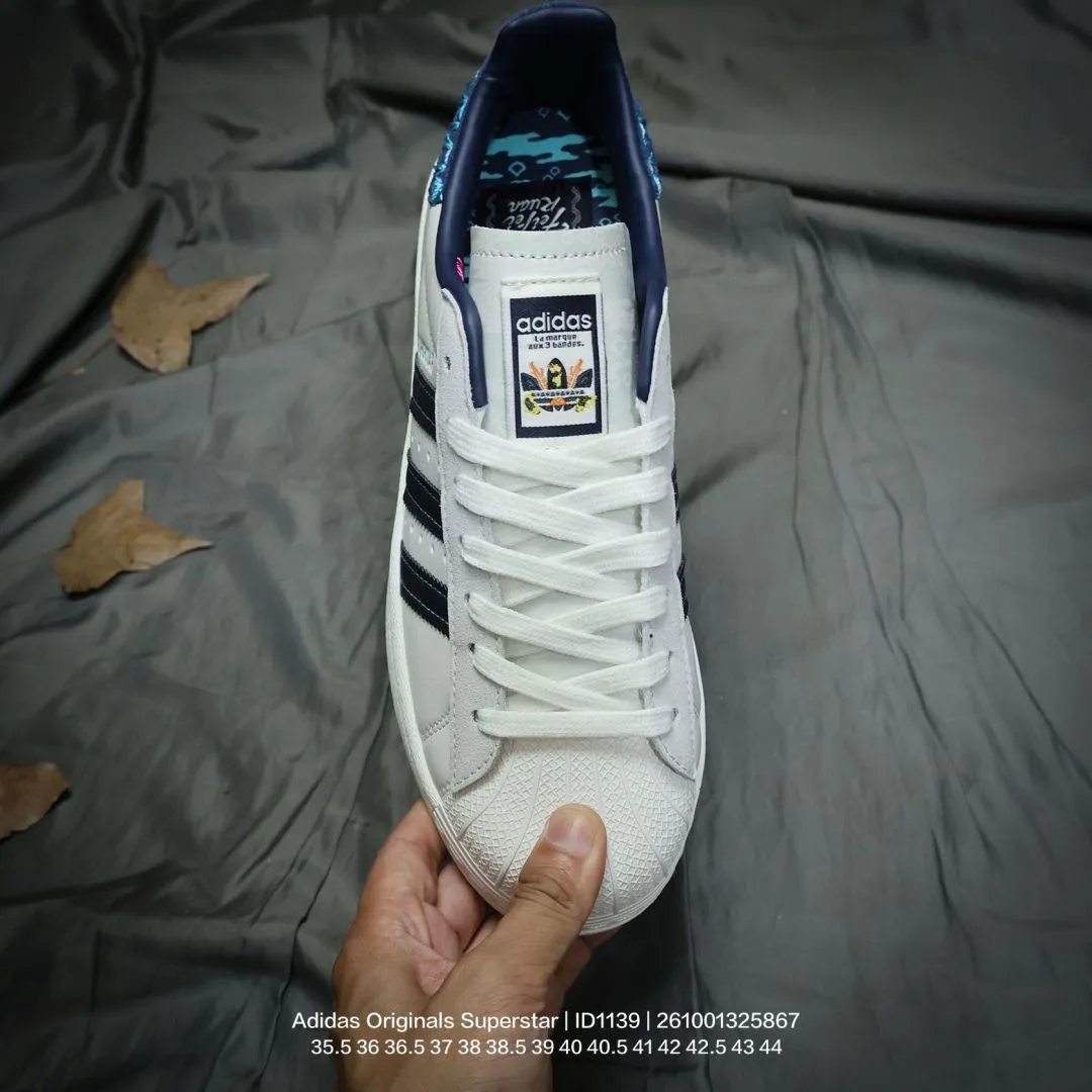 Adidas Striped Low-Top Sneakers in White · view 3