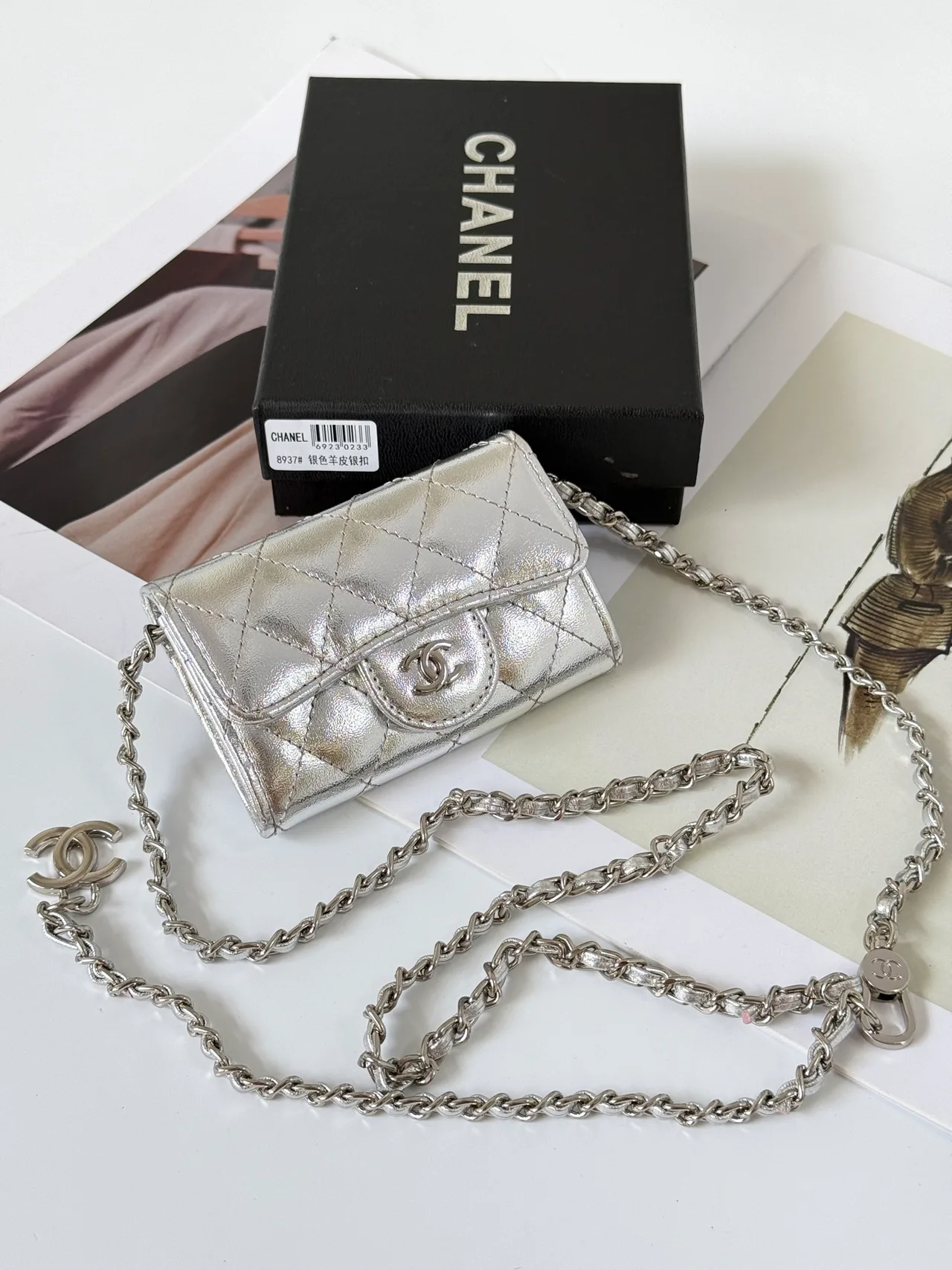 Chanel Quilted Glossy Clutch in Silver · view 1
