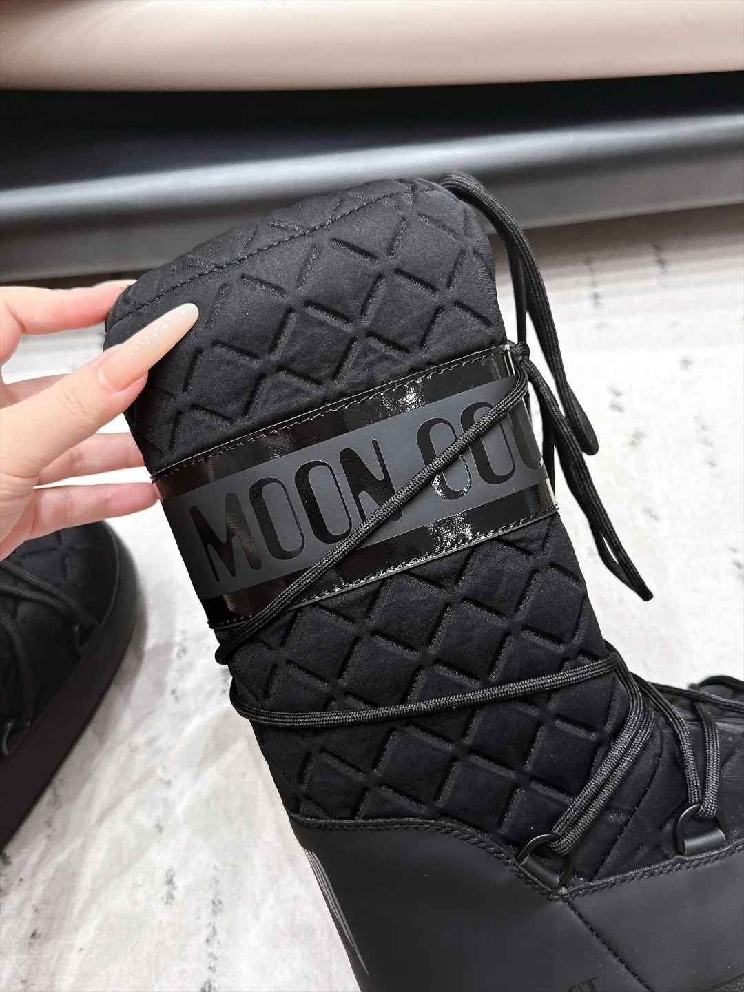 Moon Boot Glossy Quilted Snow Boots in Black · view 8
