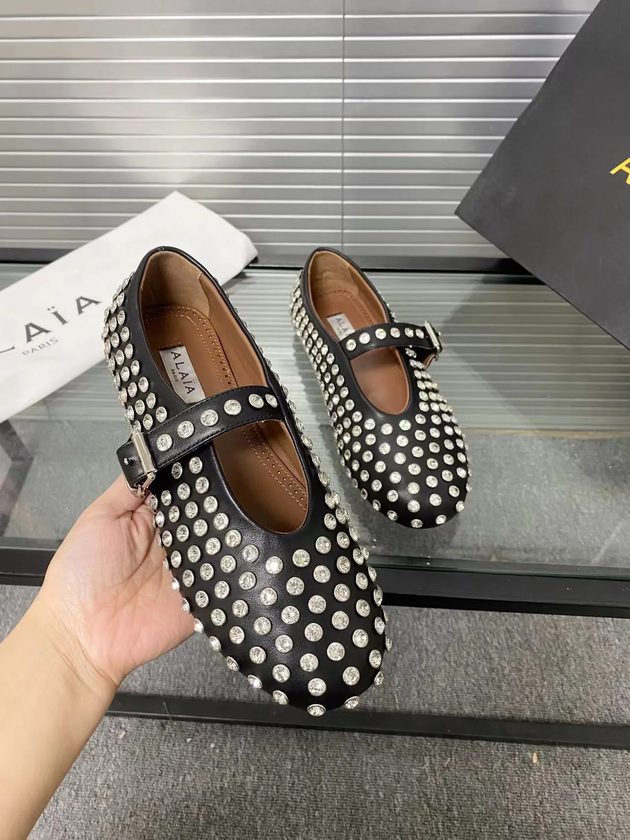 Alaia Cowhide Sheepskin Buckle Studded Mary Jane Flats in Black · view 8