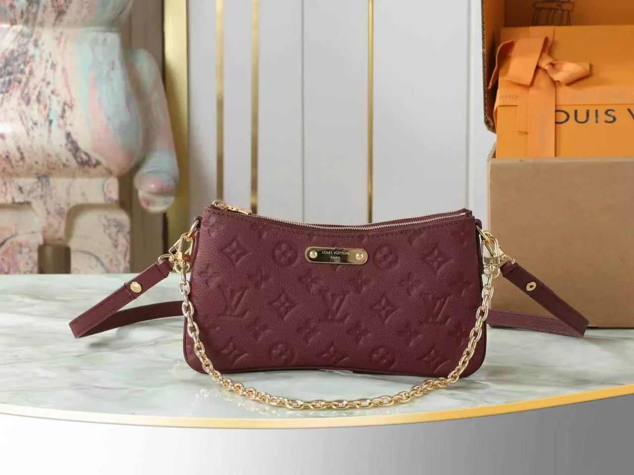 Louis Vuitton Leather Quilted Clutch in Burgundy · view 1