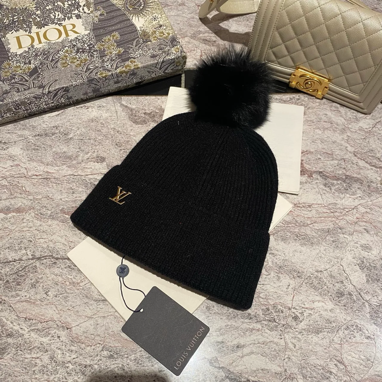 Louis Vuitton Pom-Pom Beanie in Black & White & Blue & Pink & Beige & Grey & Cream & Burgundy & Red & Tan · view 1