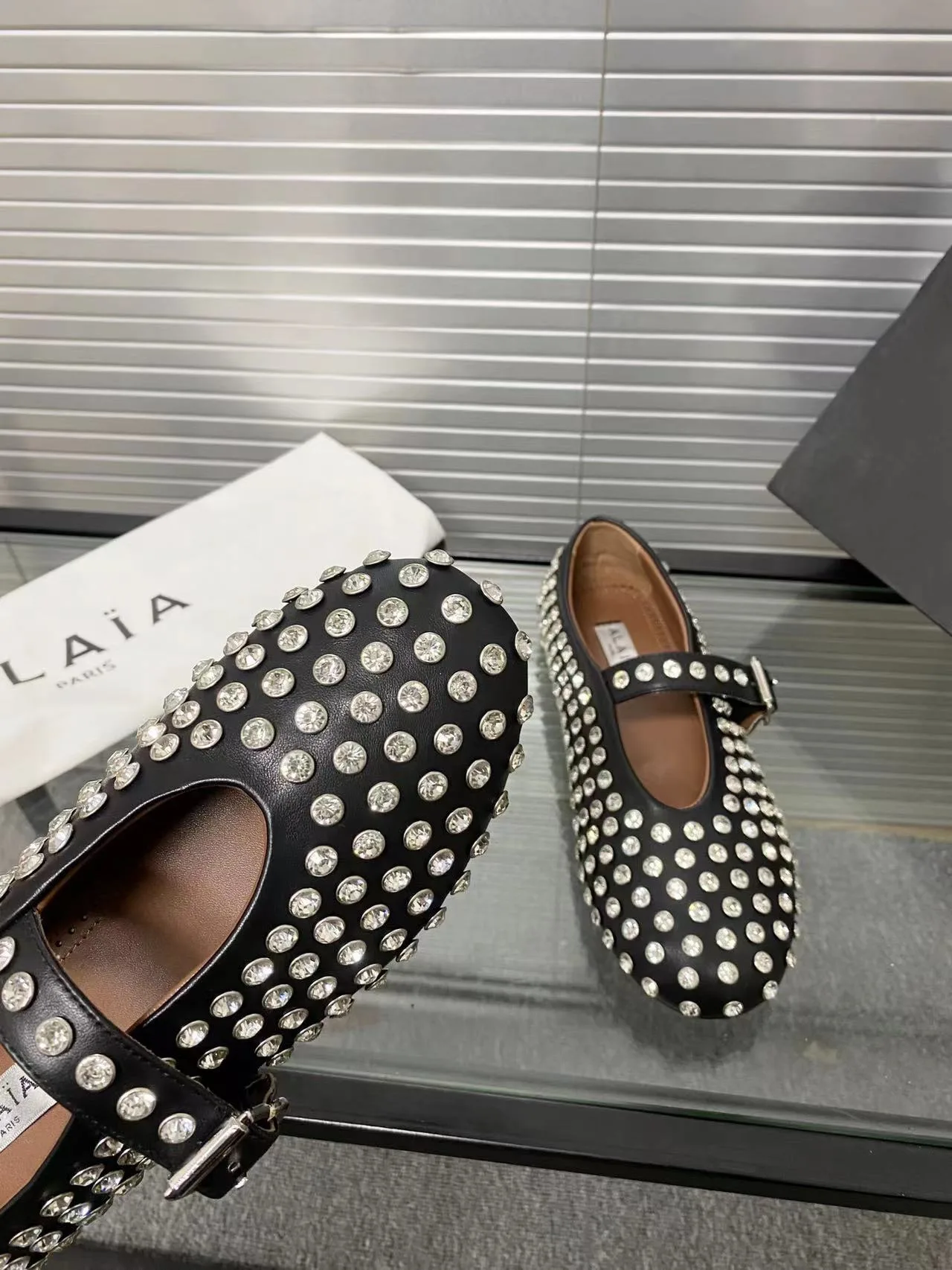Alaia Cowhide Sheepskin Buckle Studded Mary Jane Flats in Black · view 6