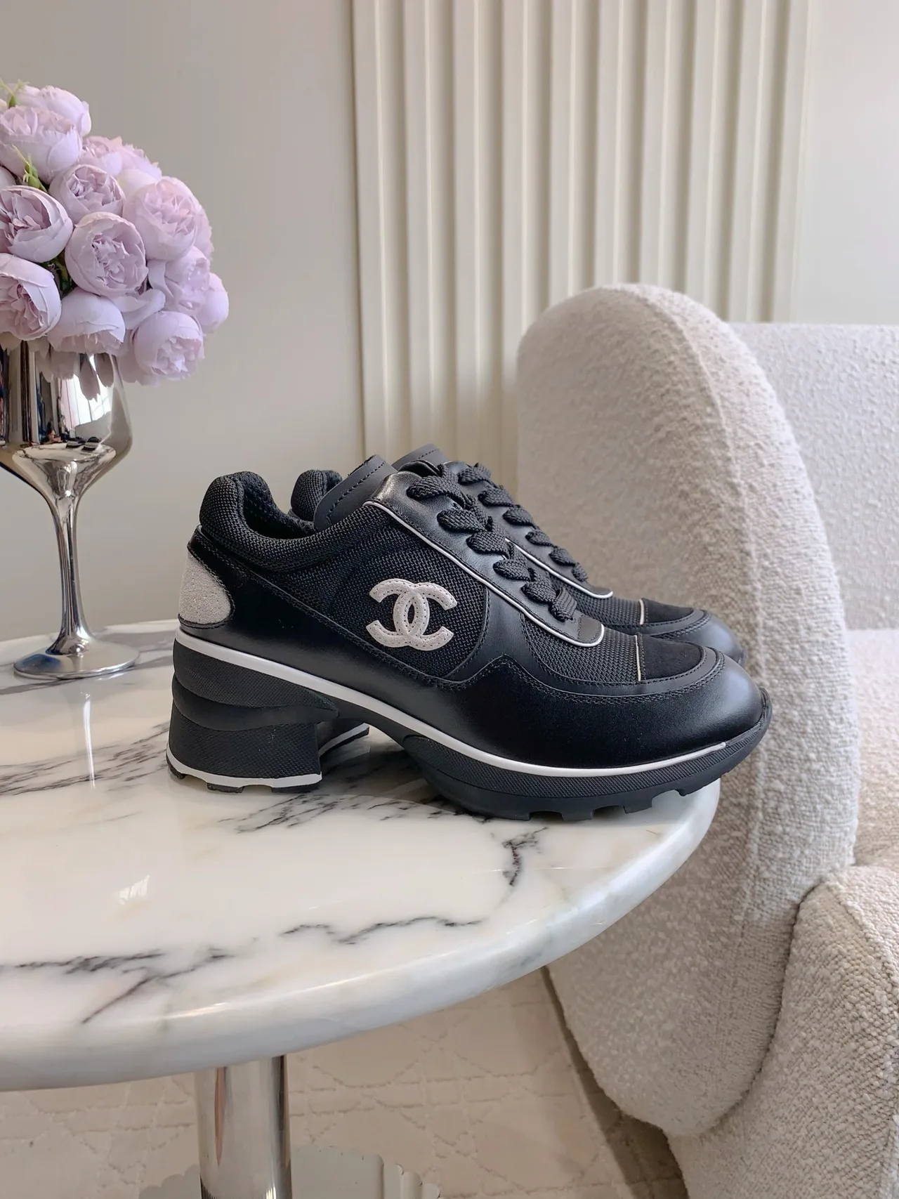 Chanel Cowhide Sneakers in Black · view 1