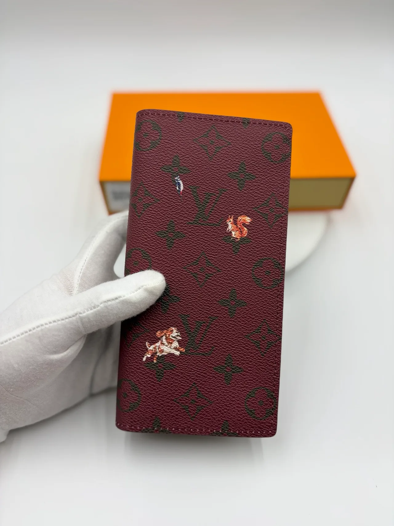 Louis Vuitton Canvas Long Wallet in Burgundy · view 1