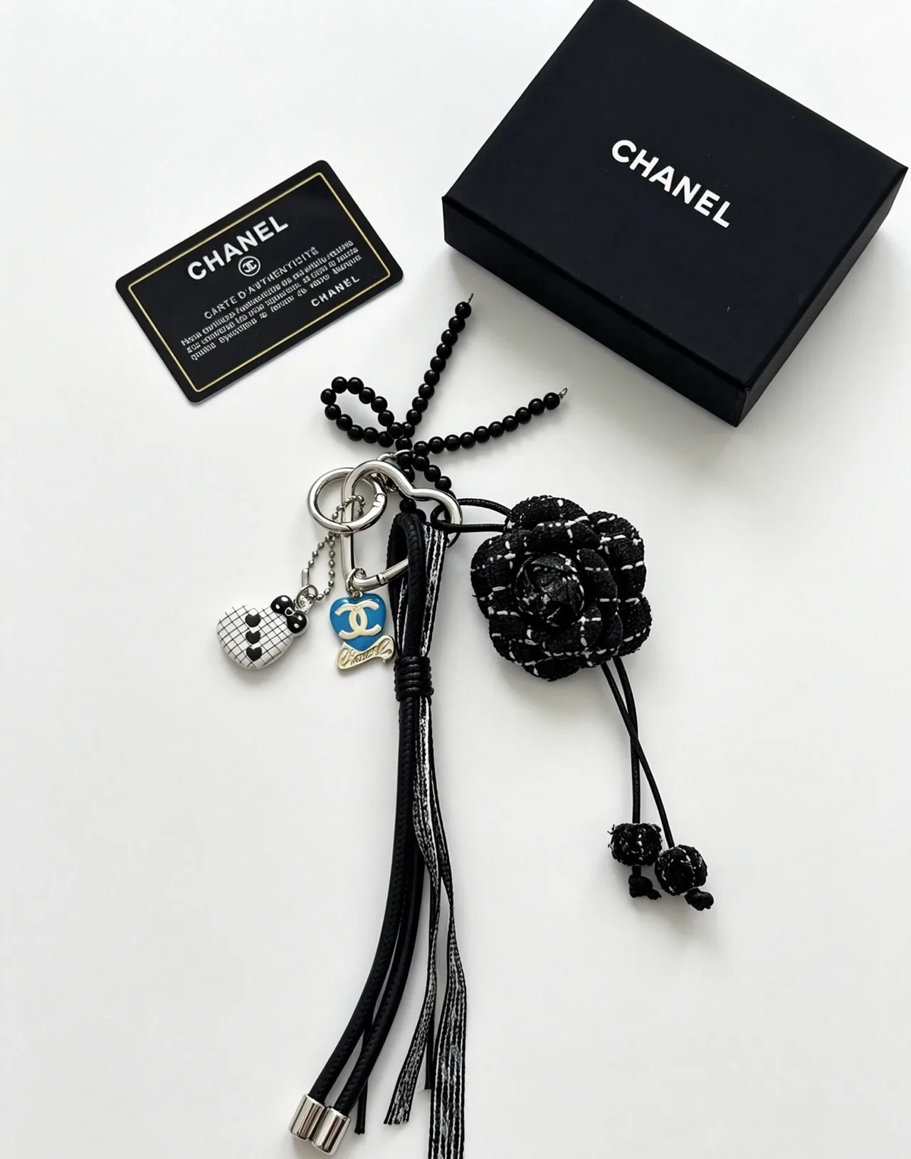 Chanel Woven Floral Tassel Keychain in Black · view 1