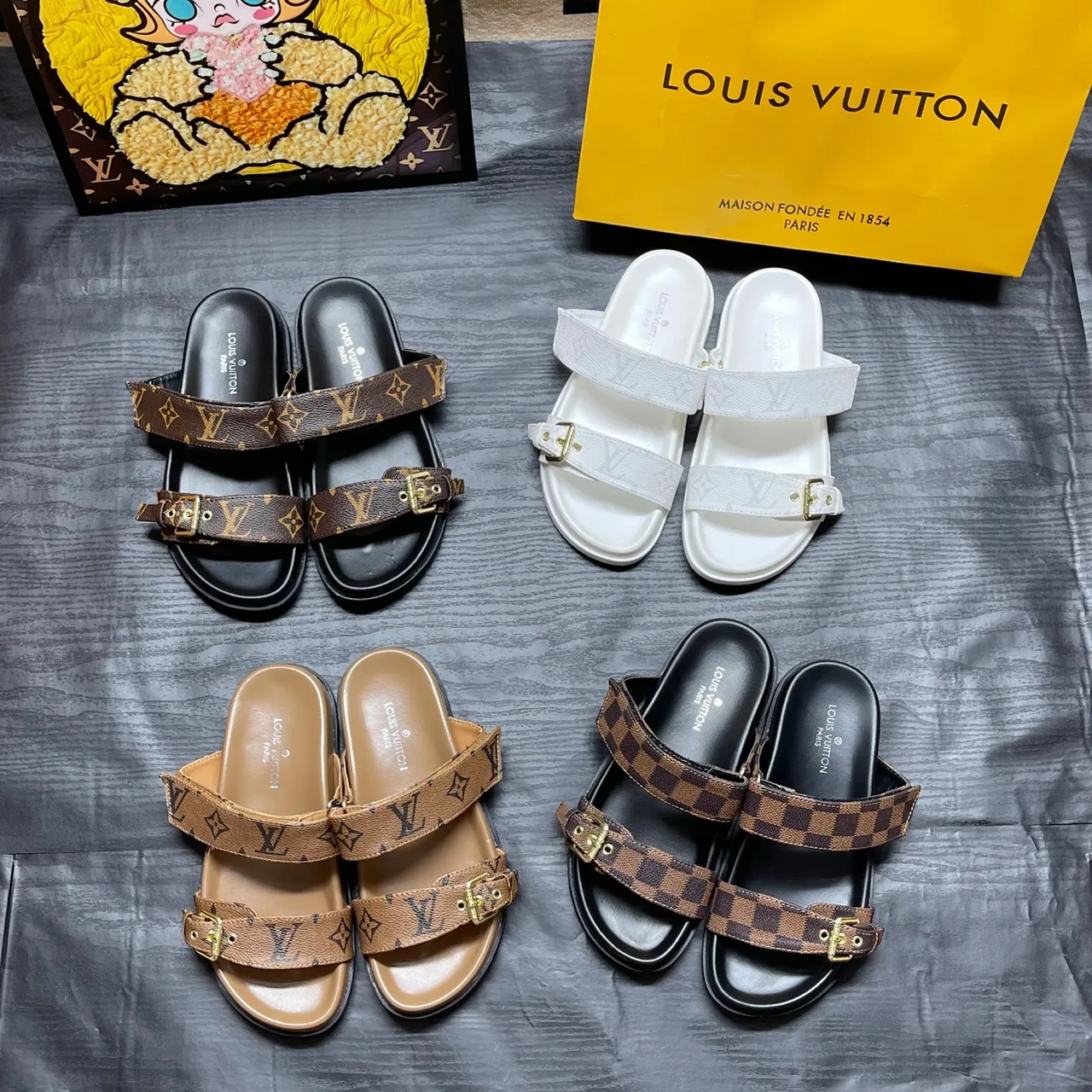 Louis Vuitton Two-Strap Buckle Slides in Black / White / Brown / Blue · view 1