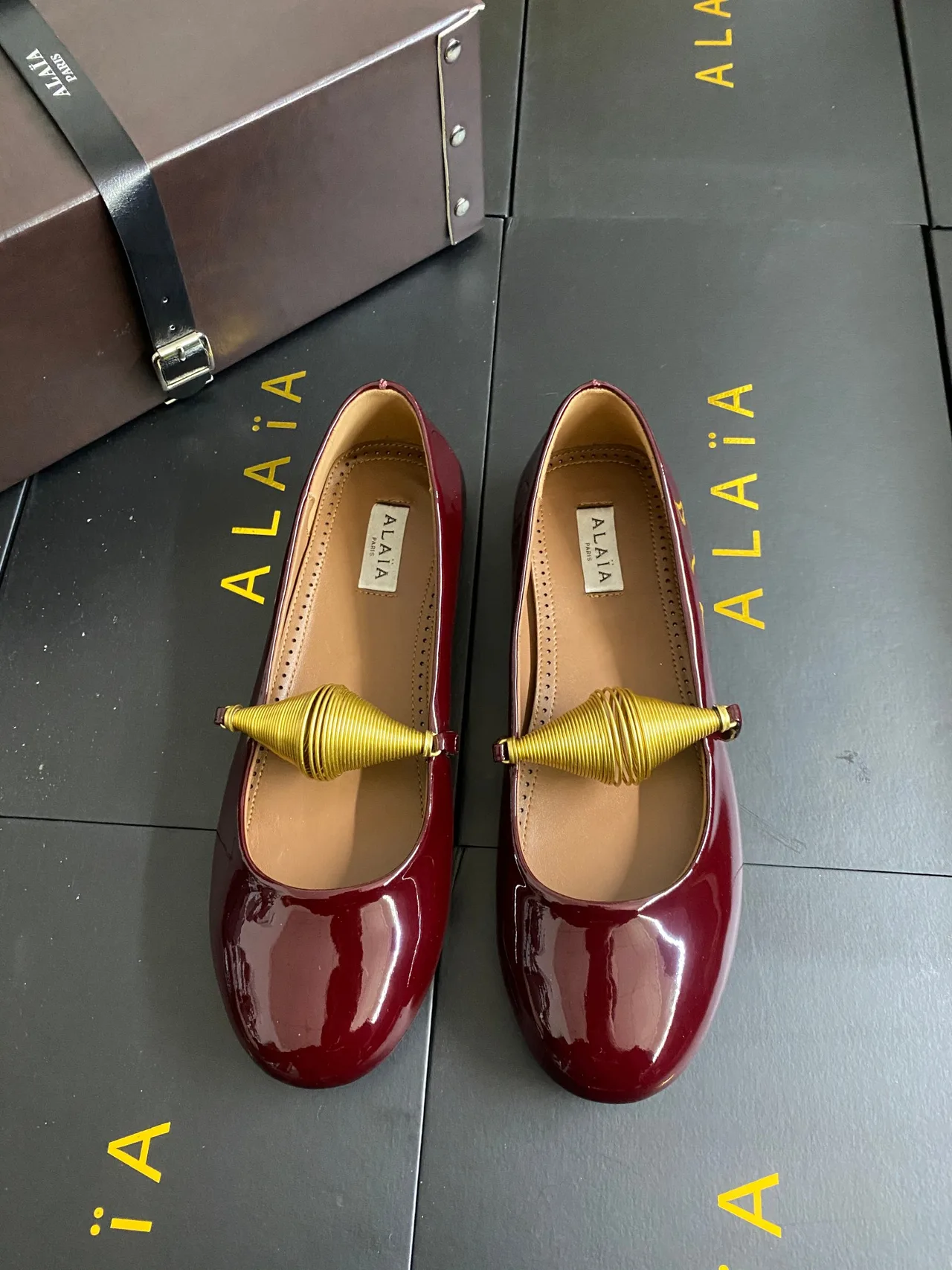 Alaia Cowhide Sheepskin Glossy Round-Toe Ballet Flats in Burgundy · view 1