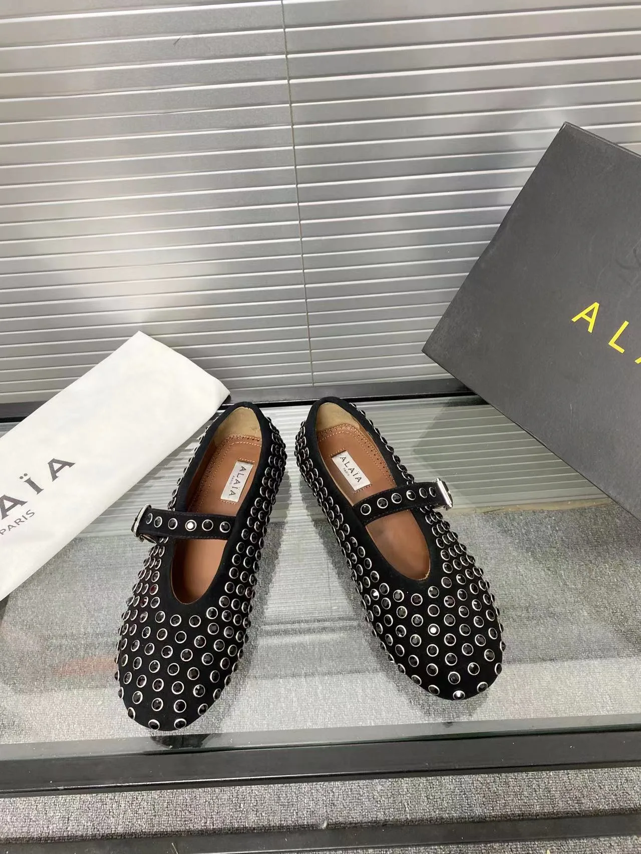 Alaia Cowhide Sheepskin Round-Toe Studded Mary Jane Flats in Black · view 3